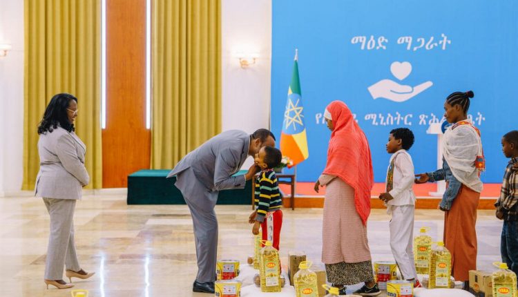PM Abiy Shares Food Items With Low Income Staff Members, Orphaned Children